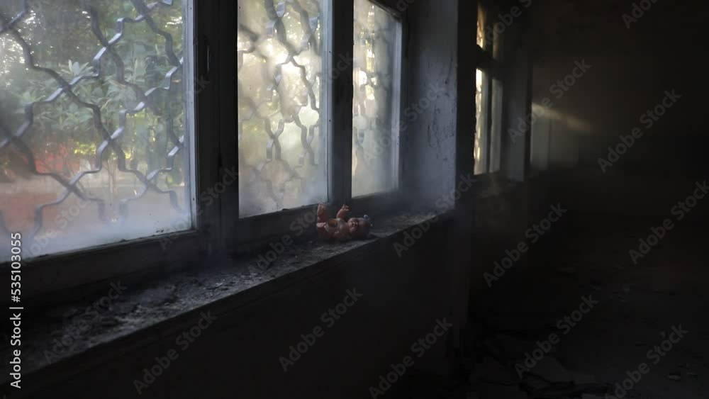Old toy on a windowsill in an abandoned house in Chernobyl Ukraine. Post apocalyptic concept. Selective focus Old toy on a windowsill in an abandoned house in Chernobyl Ukraine. Post apocalyptic concept. Selective focus