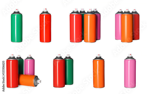 Set with colorful cans of spray paints on white background