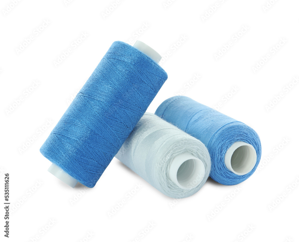Different colorful sewing threads on white background Different colorful sewing threads on white background