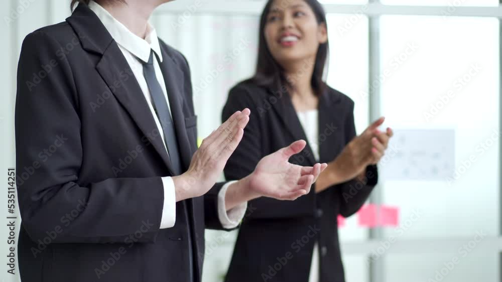 Team of Asian businessman and businesswoman touching and clapping a hands. Team of Asian businessman and businesswoman touching and clapping a hands.
