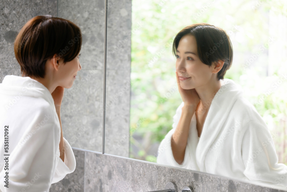 Women who look in the mirror and worry about their skin Women who look in the mirror and worry about their skin