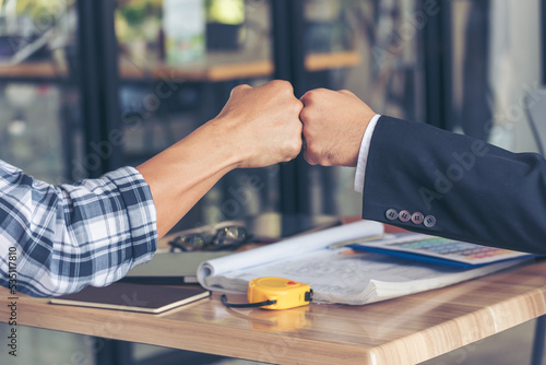 Two Men team fist bump Business Partner Businessman Trust Teamwork Partnership Industry contractor dealing mission business. Mission Business team meeting group of People Fist bump Hands together photo