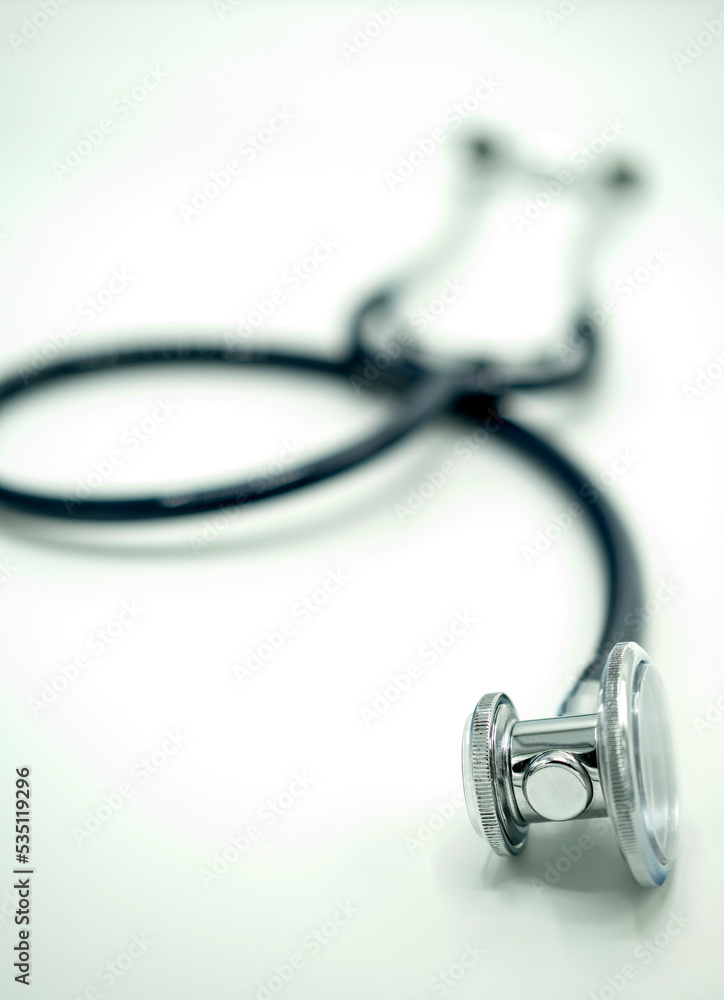 Stethoscope with narrow focus on white tabletop