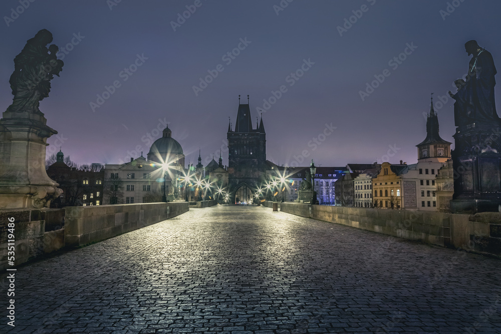 Charles bridge illuminated at dawn, Medieval Prague, Czech Republic