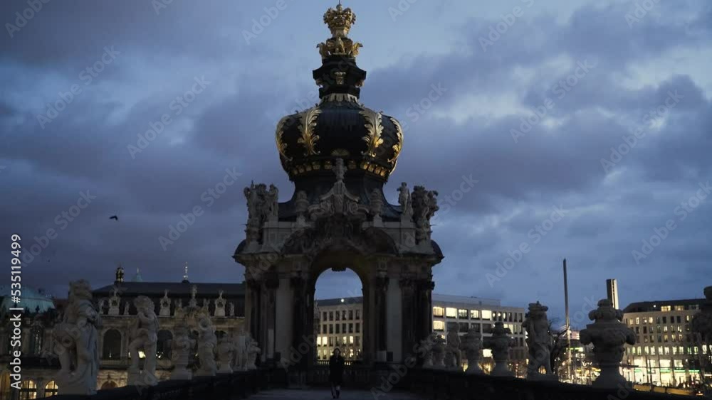 young woman in a black coat standing on a terrace young woman in a black coat standing on a terrace