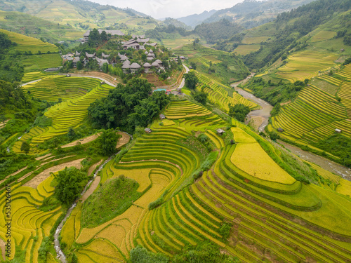 Aerial view of golden rice terraces at Mu cang chai town near Sapa city, north of Vietnam. Beautiful terraced rice field in harvest season in Yen Bai, Vietnam