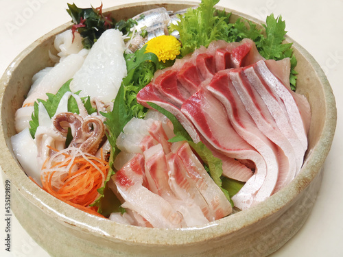 Squid, Red sea bream, Sardine, Yellowtail, arranged to sashimi style plate.