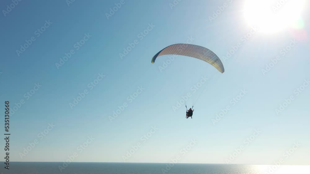 aerial view slow motion filming of active leisure with paragliding, active lifestyle extreme sport concept. Ukraine, Kherson region, Stanislav aerial view slow motion filming of active leisure with paragliding, active lifestyle extreme sport concept. Ukraine, Kherson region, Stanislav