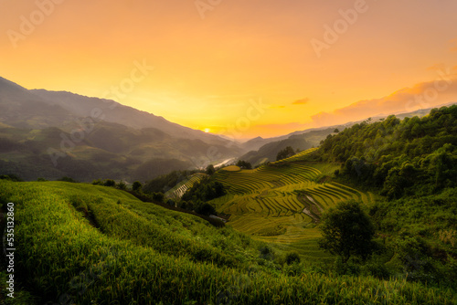 Aerial view of golden rice terraces at Mu cang chai town near Sapa city, north of Vietnam. Beautiful terraced rice field in harvest season in Yen Bai, Vietnam