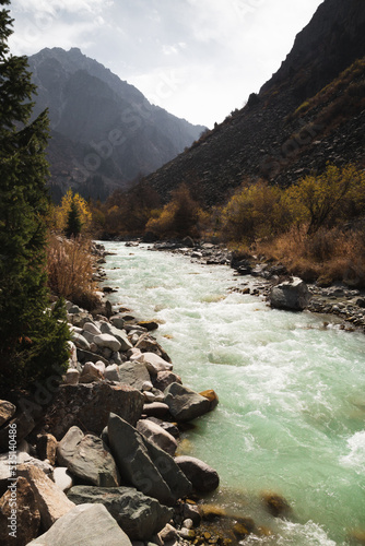 Glacial river flows through the Ala Archa mountain pass photo