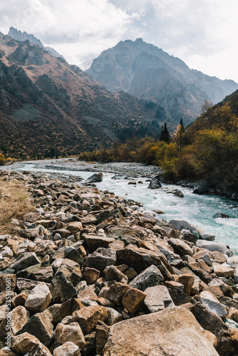 Glacial river flows through the Ala Archa mountain pass photo