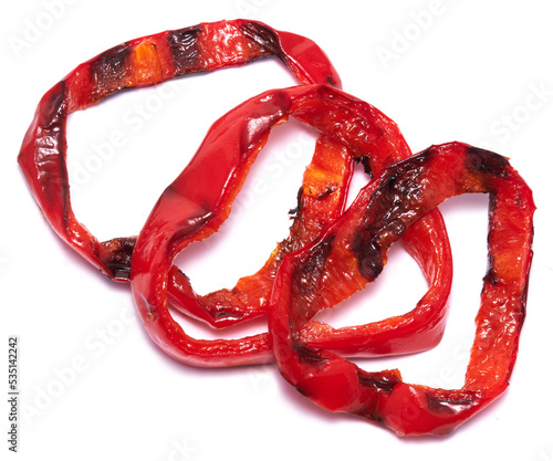 Grilled Slices of red pepper with stripes from a grill isolated on white background