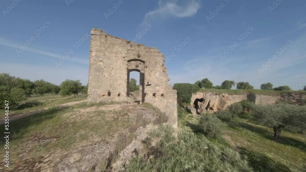 FPV aerial follows drone flying precision through building wall ruins FPV aerial follows drone flying precision through building wall ruins