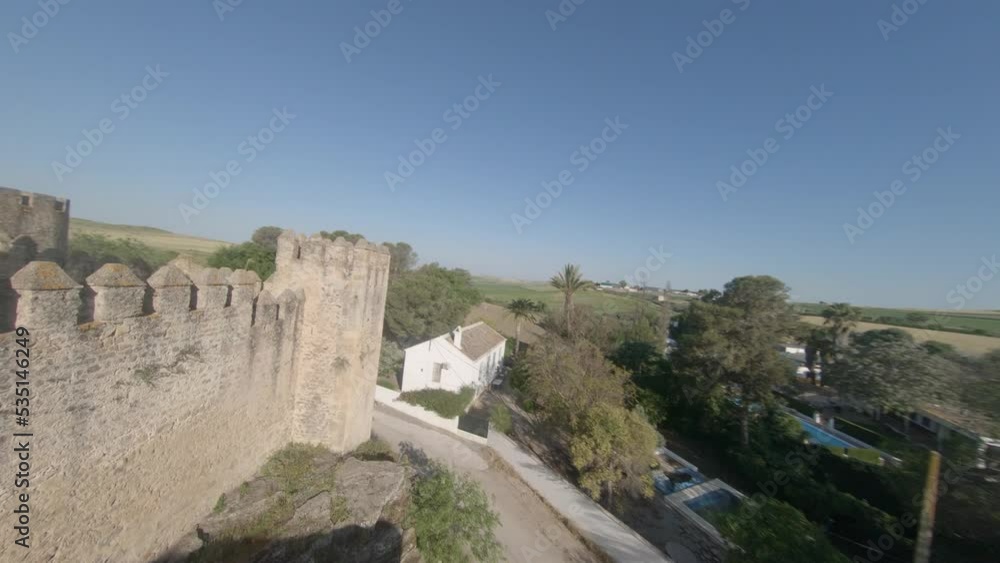FPV aerial flies over castle wall and along medieval rampart wall walk FPV aerial flies over castle wall and along medieval rampart wall walk
