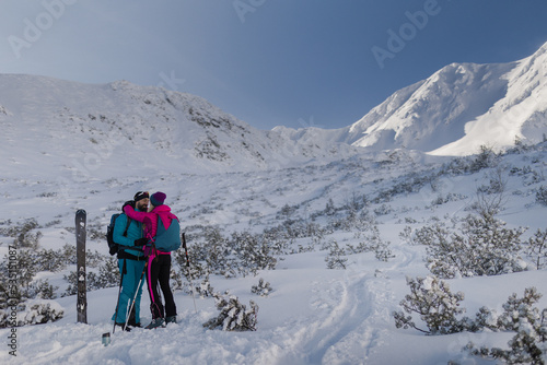 Ski touring couple in love taking break on the top of mountain in the Low Tatras in Slovakia. © Halfpoint
