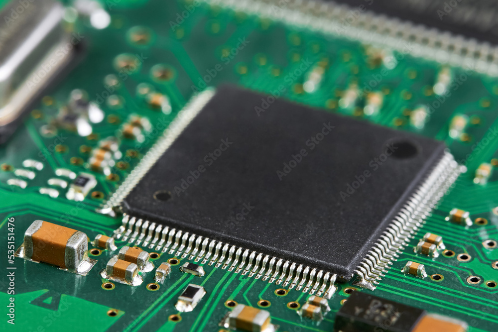 Close-up of computer chip on a part of electronic printed circuit board Close-up of computer chip on a part of electronic printed circuit board