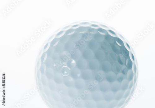 Macro shot of golf ball isolated on white background