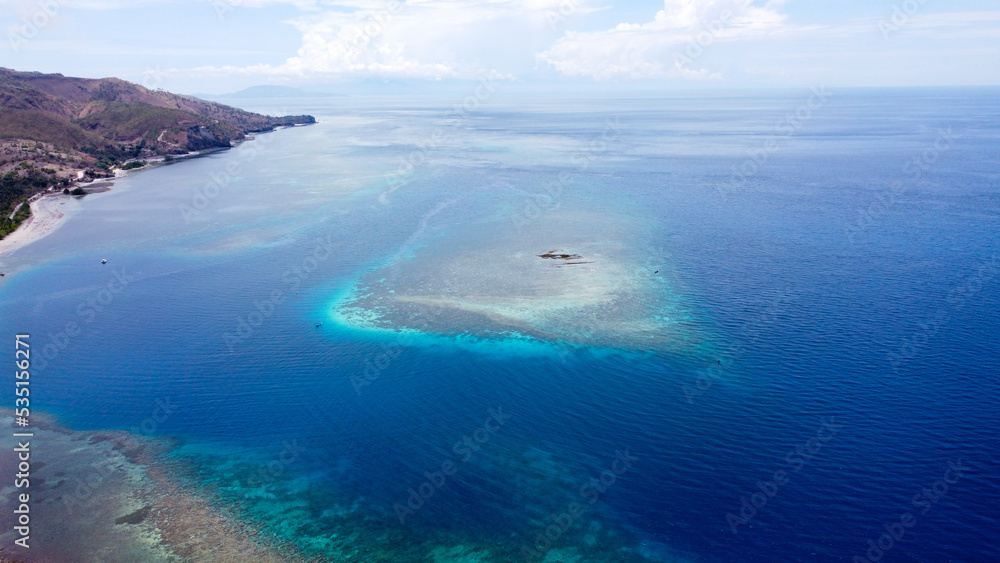 A pristine, healthy coral reef ecosystem on the biodiverse Coral Triangle, on remote tropical Atauro Island in Timor Leste, Southeast Asia, aerial drone of view from above A pristine, healthy coral reef ecosystem on the biodiverse Coral Triangle, on remote tropical Atauro Island in Timor Leste, Southeast Asia, aerial drone of view from above