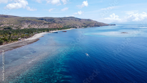 White sandy beaches, biodiverse coral reef ecosystems, and stunning blue ocean water on the remote tropical Atauro Island, Timor Leste, Southeast Asia 