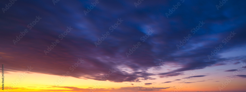 Fototapeta premium Sky with clouds during sunset. Clouds and blue sky. A high-resolution photograph. Panoramic photo for design and background.