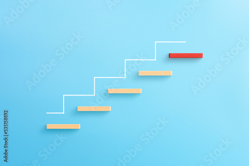 Wooden blocks stacking as step stair, Ladder of success in business growth concept