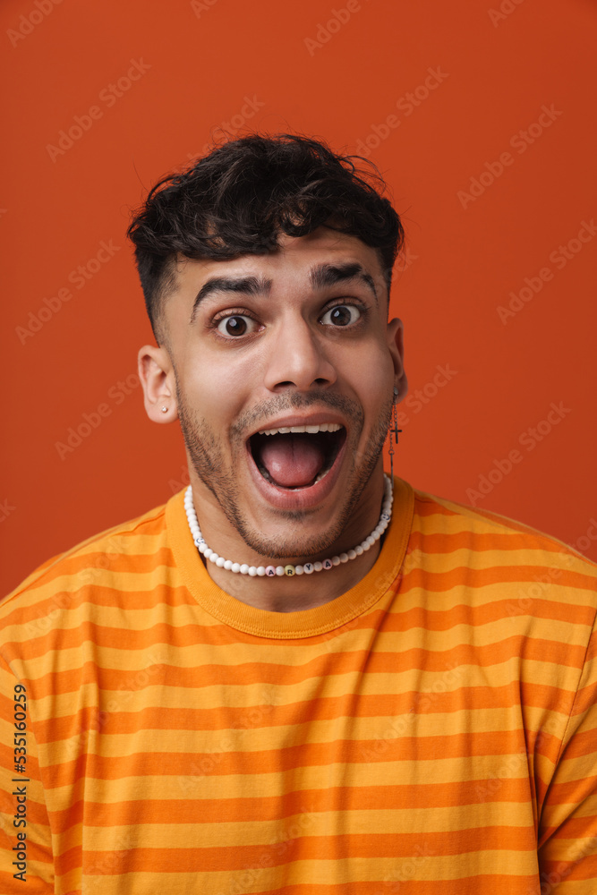 Young stylish man with opened mouth and piercing in necklace Young stylish man with opened mouth and piercing in necklace