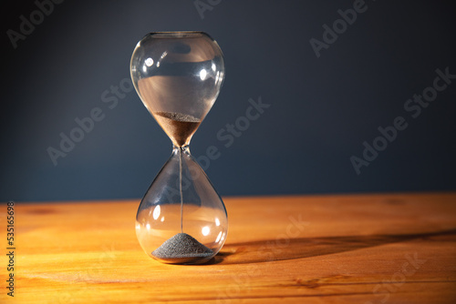 Hourglass on the table.