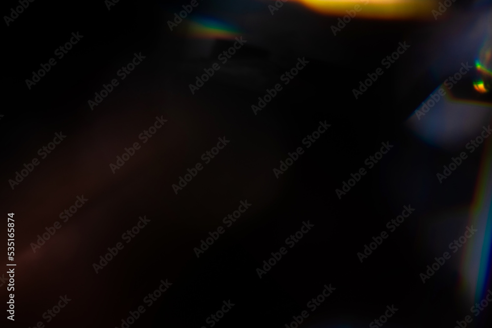 Blur colorful rainbow crystal light leaks on black background. Defocused abstract multicolored retro film lens flare bokeh analog photo overlay or screen filter effect. Glow Vintage prism colors Blur colorful rainbow crystal light leaks on black background. Defocused abstract multicolored retro film lens flare bokeh analog photo overlay or screen filter effect. Glow Vintage prism colors