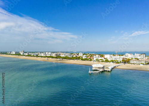 Lignano Sabbiadoro panoramica aerea della spiaggia sul mare  con cielo blu