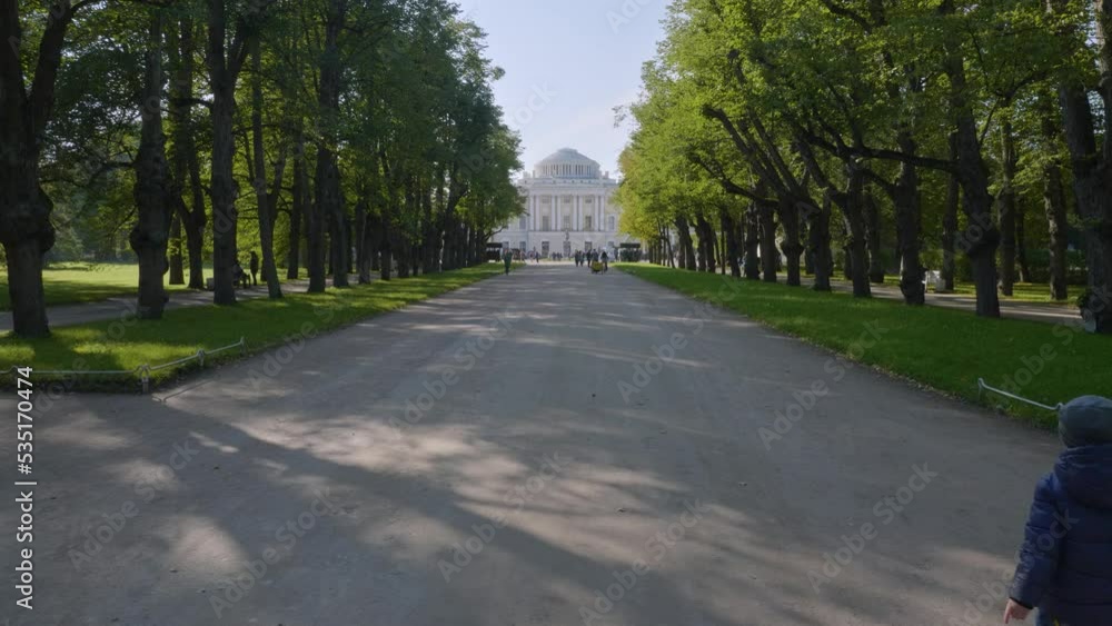 State museum Pavlovsk in autumn. People on the Triple Lime Avenue. State museum Pavlovsk in autumn. People on the Triple Lime Avenue.