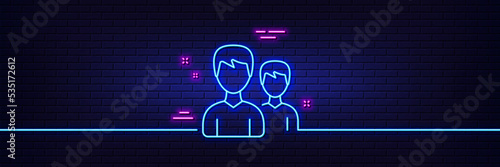 Neon light glow effect. User line icon. Couple or Group sign. Male Person silhouette symbol. 3d line neon glow icon. Brick wall banner. Couple outline. Vector