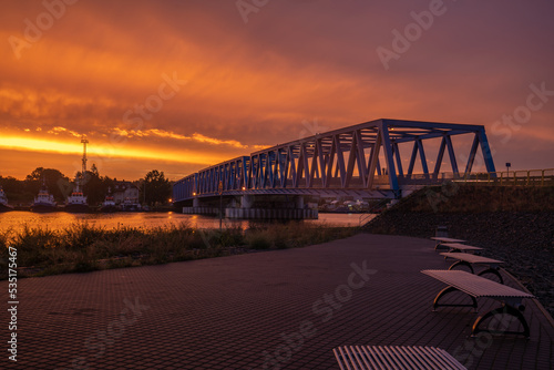 Parking by the river in an industrial area during a spectacular sunset,cgi backplate production.