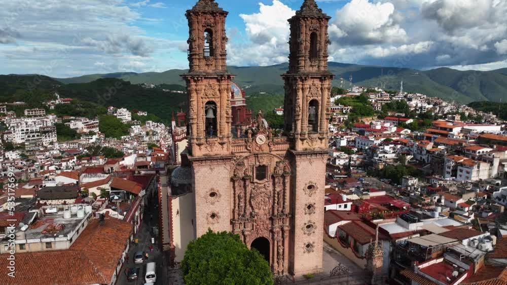 Aerial view in front of the Church of Santa Prisca de Taxco, in sunny ...