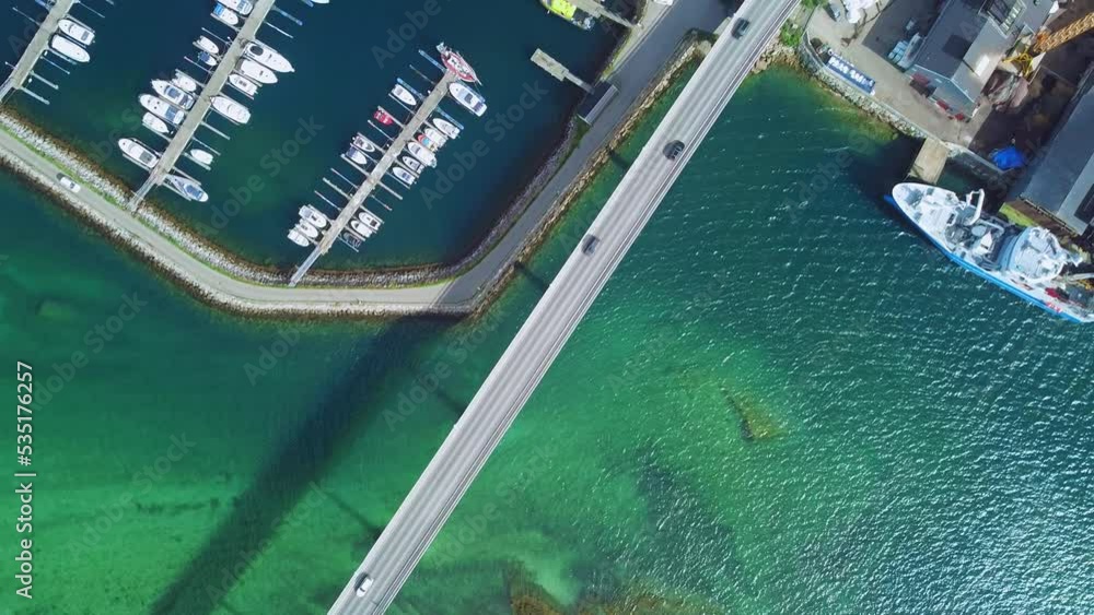 Birds Eye Aerial View of Traffic on Gisundbrua Bridge, Connecting Senja and Lofoten Islands to Mainland Norway, Top Down Drone Shot Birds Eye Aerial View of Traffic on Gisundbrua Bridge, Connecting Senja and Lofoten Islands to Mainland Norway, Top Down Drone Shot