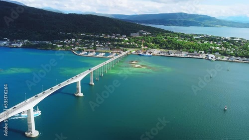 Gisund Bridge, Senja Island, Norway. Aerial View of Famous Scenic Crossing Above Scandinavian Fjord on Sunny Summer Day photo