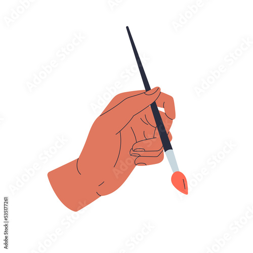 Hand holding paintbrush. Painters arm drawing with paint brush. Artists finge...