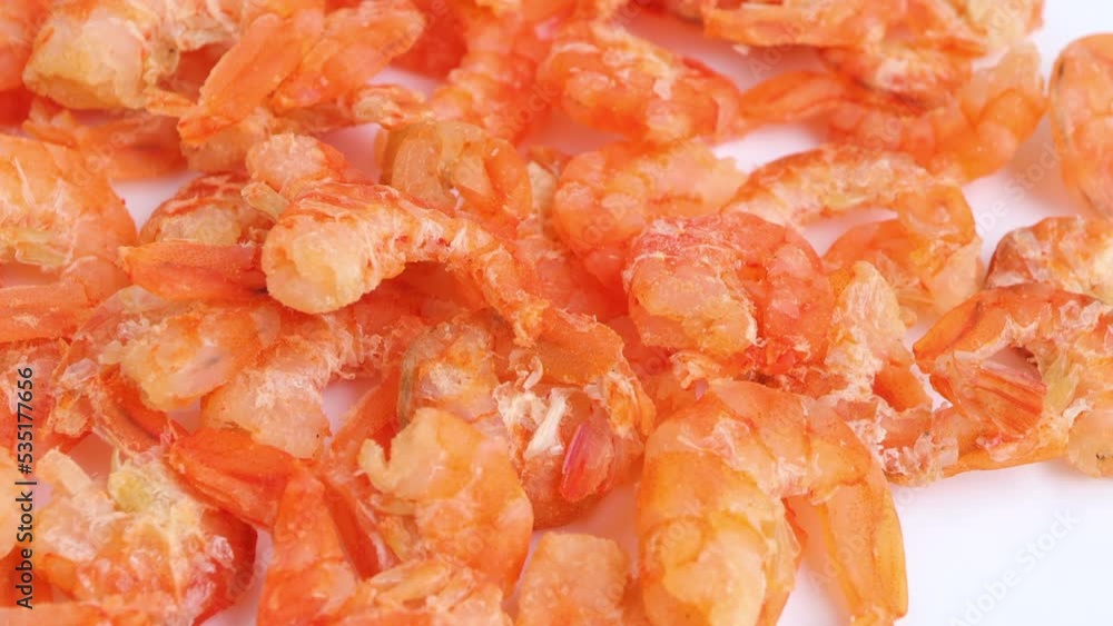 Dried salted prawn on white background. Selective focus. Rotating on turn table. Dried salted prawn on white background. Selective focus. Rotating on turn table.