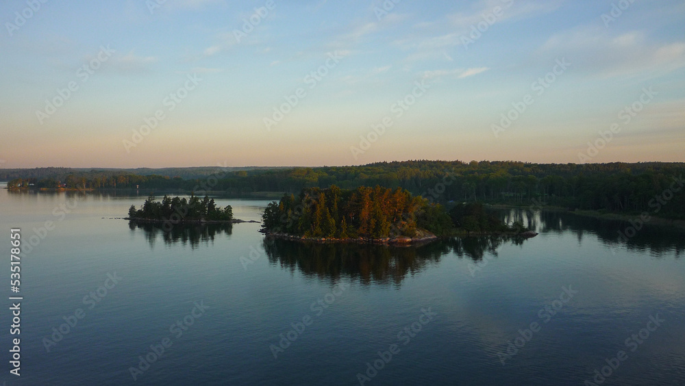 View from outdoor deck of cruiseship cruise ship liner sailing through Stockholm archipelago islands during sunrise twilight early morning hour blue hour nature landscape scenery beauty Baltic cruisin