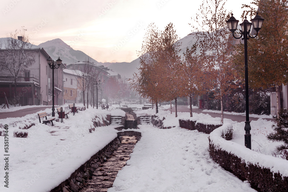 Bansko, Bulgaria street view and Pirin mountains Bansko, Bulgaria street view and Pirin mountains