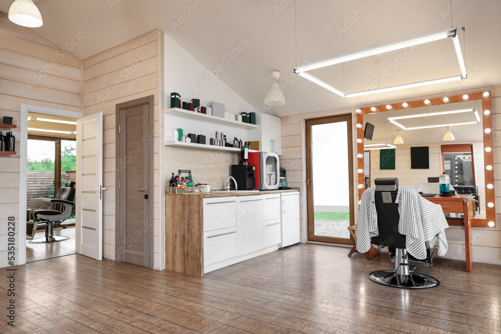 Fototapeta premium Stylish barbershop interior with professional hairdresser's workplace