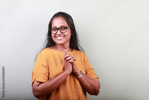 Portrait of a woman of Indian ethnicity with a smiling face