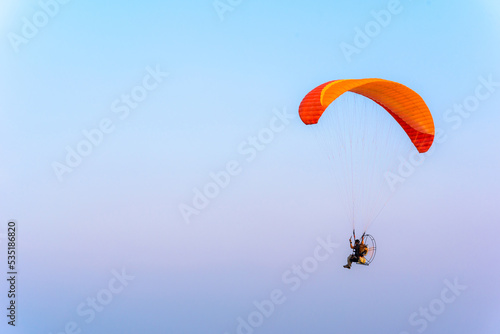 Paramotor flying on the sky, Paramotor flying on the sky ,adventure man active extreme sport pilot flying in sky with paramotor