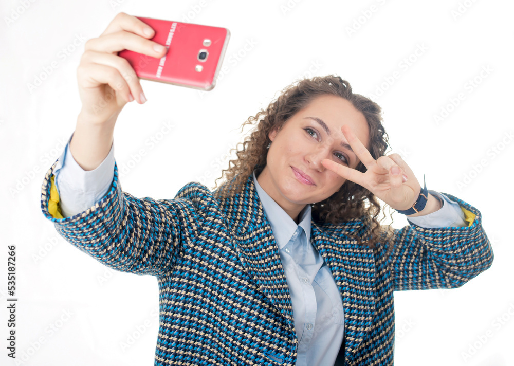 of a cute lovely woman taking selfie and showing peace sign with fingers over white background of a cute lovely woman taking selfie and showing peace sign with fingers over white background