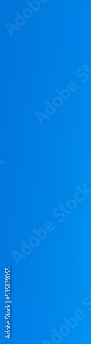 blue peaceful sky without clouds. Vertical banner for insertion into site. Place for text cope space.