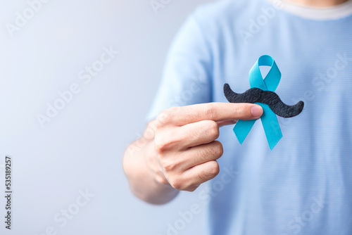 November Prostate Cancer Awareness month, Blue Ribbon with mustache for supporting people living and illness. Healthcare, International men, Father and World cancer day concept photo