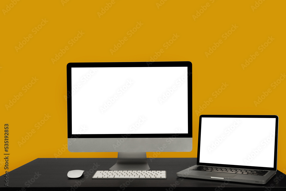 Workplace with notebook laptop and blank screen desktop computer work. Workplace with notebook laptop and blank screen desktop computer work.