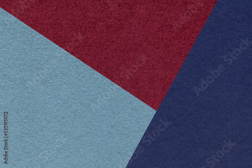 Texture of craft navy blue, wine and denim shade color paper background, macro. Vintage abstract cardboard