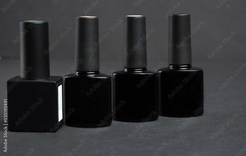 Gel polish on a black background close-up. Gel polish on a black background close-up.