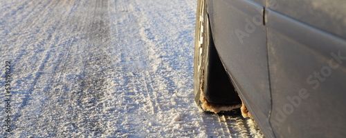 Canvas-taulu Car winter tire on snow covered road