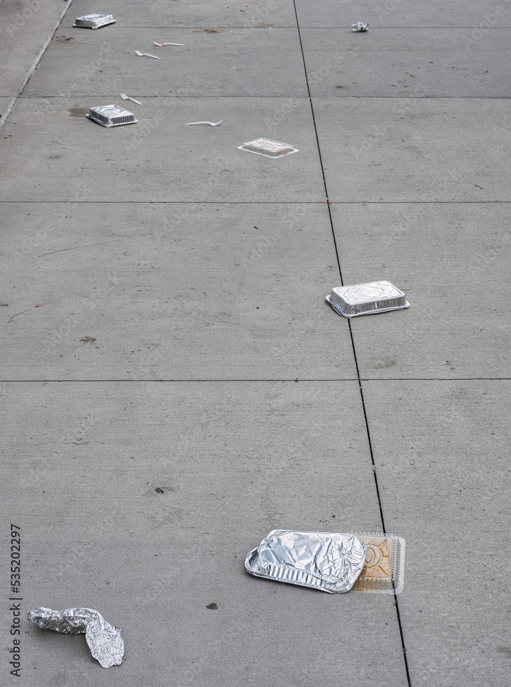 uncivil behavior at street with fast food trash